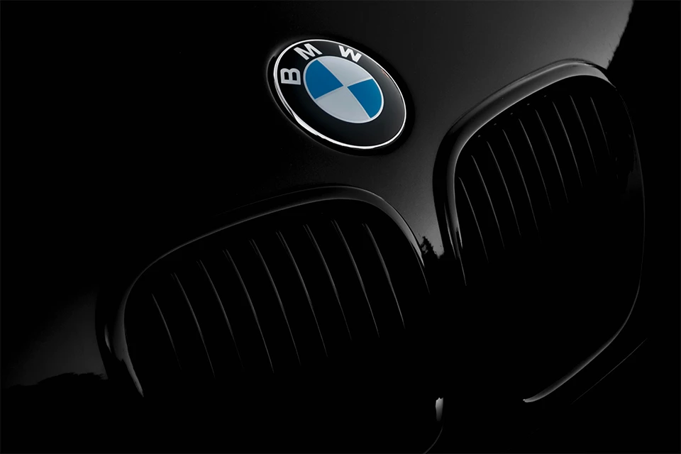 Front of black BMW including the BMW logo