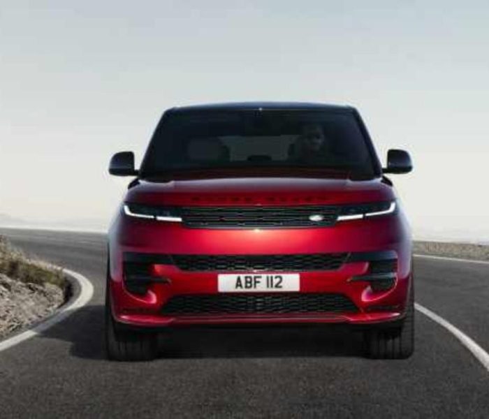 Photo of the new Range Rover Sport in red on a road