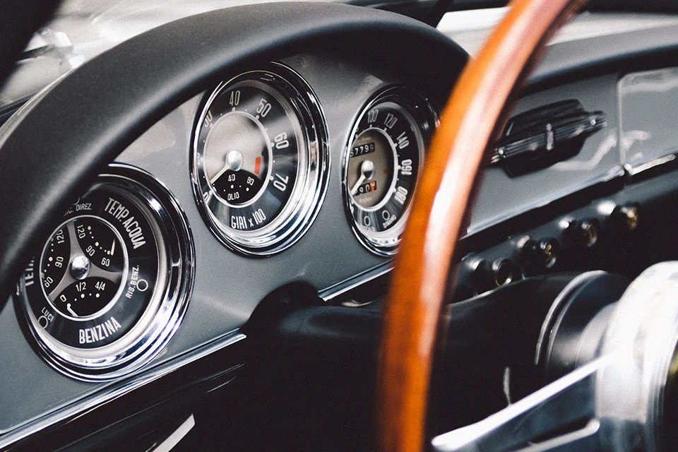 Close-up image of the dashboard of a classic car