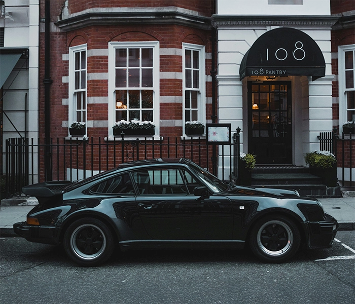 Black Porsche 911 on an English street