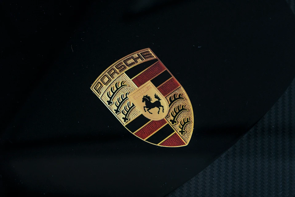 Close up of the Porsche logo