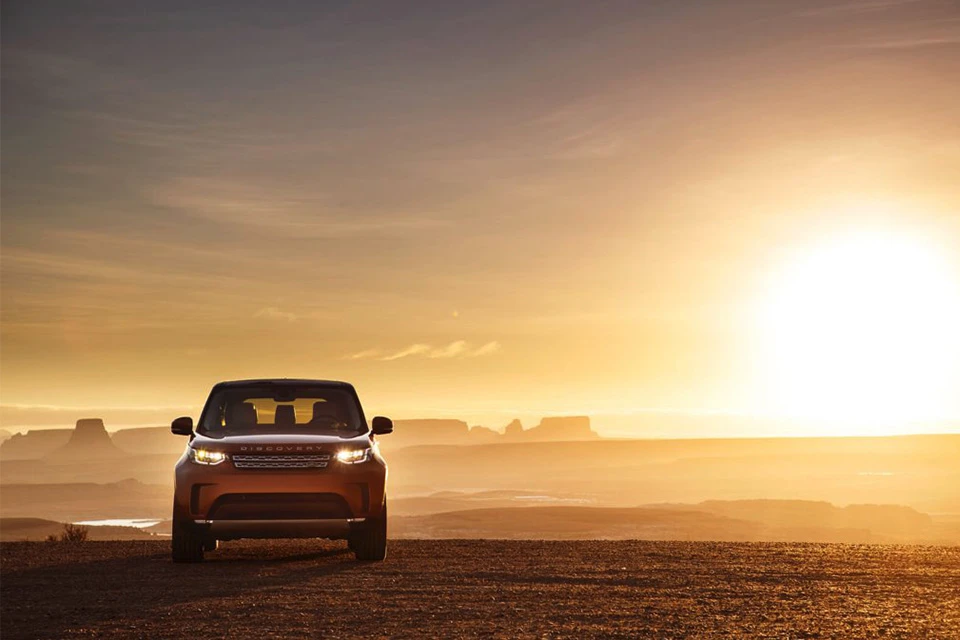 Range Rover Discovery with a sunset in the background