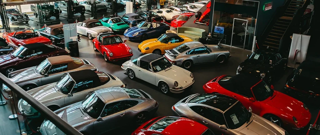 Top-down view of vintage cars stored in a car dealership